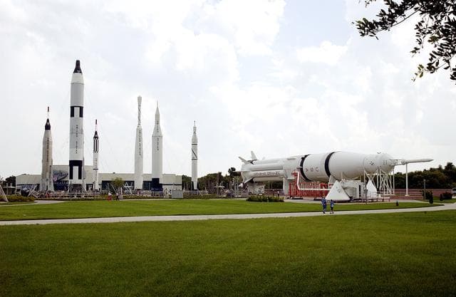 NASA image: KENNEDY SPACE CENTER, FLA.  -  The Rocket Garden at the KSC Visitor Complex features eight authentic rockets from the past, including a Mercury-Atlas rocket.  The garden also features a climb-in Mercury, Gemino and Apollo capsule replicas, seating pods and informative graphic elements.