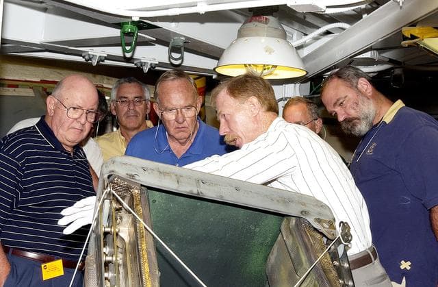 NASA image: KENNEDY SPACE CENTER, FLA.  - On a tour of the Orbiter Processing Facility, members of the Stafford-Covey Return to Flight Task Group (SCTG) look at one of the Reinforced Carbon-Carbon panels, being shown by Tom Roberts with United Space Alliance, from the orbiter Endeavour.  Chairing the task group are Richard O. Covey, former Space Shuttle commander, and Thomas P. Stafford, Apollo commander.  Chartered by NASA Administrator Sean O’Keefe, the task group will perform an independent assessment of NASA’s implementation of the final recommendations by the Columbia Accident Investigation Board.