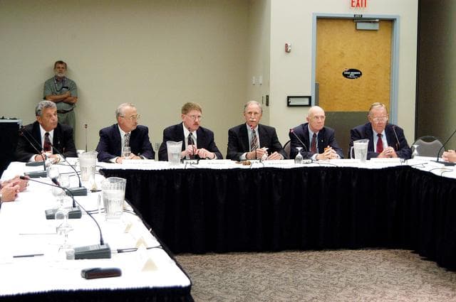 NASA image: KENNEDY SPACE CENTER, FLA.  -  The Return To Flight Task Group (RTFTG) holds the first public meeting at the Debus Center, KSC Visitor Complex.  Members and staff at this table, from left, are Joseph W. Cuzzupolui, retired Army Col. James C. Adamson, David Lenyel, co-chairs Richard O. Covey and retired Air Force Lt. Gen. Thomas Stafford, and retired Air Force Maj. Gen. Ralph H. Jacobson.  Covey is a former astronaut and Shuttle commander.  Stafford is a former astronaut and Apollo commander.  The RTFTG was at KSC to conduct organizational activities, tour Space Shuttle facilities and receive briefings on Shuttle-related topics.  The task group was chartered by NASA Administrator Sean O’Keefe to perform an independent assessment of NASA’s implementation of the final recommendations of the Columbia Accident Investigation Board.