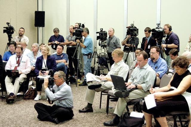 NASA image: KENNEDY SPACE CENTER, FLA.  -  The news media capture the words and images of the Return To Flight Task Group (RTFTG) which held its first public meeting at the Debus Center, KSC Visitor Complex.  The group is co-chaired by former Shuttle commander Richard O. Covey and retired Air Force Lt. Gen. Thomas P. Stafford, who was an Apollo commander. The RTFTG was at KSC to conduct organizational activities, tour Space Shuttle facilities and receive briefings on Shuttle-related topics.  The task group was chartered by NASA Administrator Sean O’Keefe to perform an independent assessment of NASA’s implementation of the final recommendations of the Columbia Accident Investigation Board.