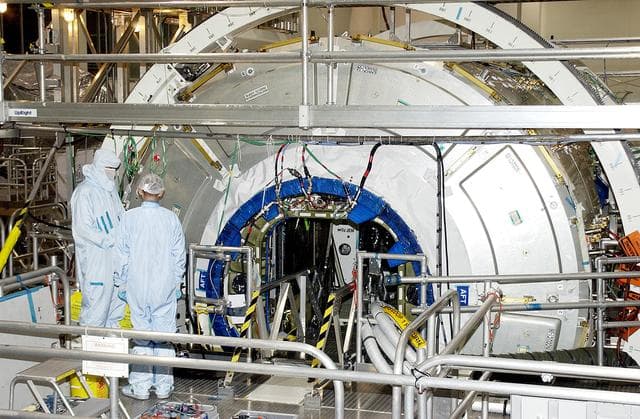 NASA image: KENNEDY SPACE CENTER, FLA.  -  Work is ongoing on the U.S. Node 2 in the Space Station Processing Facility.  The second of three Space Station connecting modules, the Italian-built Node 2 attaches to the end of the U.S. Lab and will provide attach locations for the Japanese laboratory, European laboratory, the Centrifuge Accommodation Module and, later, Multipurpose Logistics Modules. It will provide the primary docking location for the Shuttle when a pressurized mating adapter is attached to Node 2.  Installation of the module will complete the U.S. Core of the ISS.  Node 2 is the designated payload for mission STS-120.  No orbiter or launch date has been determined yet.