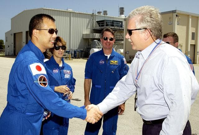 NASA image: KENNEDY SPACE CENTER, FLA. -   The STS-114 crew is welcomed to Hangar AF, Cape Canaveral Air Force Station, by Joseph Chaput, with United Space Alliance. The crew, from left, are Mission Specialist Soichi Noguchi, Commander Eileen Collins, Mission Specialist Stephen Robinson and (partially hidden) Pilot James Kelly.  Noguchi is with the Japanese space agency NASDA.  On the mission, the crew will carry the MultiPurpose Logistics Module (MPLM) Raffaello and External Stowage Platform 2 to the International Space Station.  The MPLM will contain supplies and equipment.  Another goal of the mission is to remove and replace a Control Moment Gyro.  Launch date for mission STS-114 is under review.  Hangar AF is the site where SRB Retrieval Ships return the spent solid rocket boosters after a Shuttle launch.  The SRBs are lifted from the water and placed on rail cars to begin the disassembly and refurbishment process.