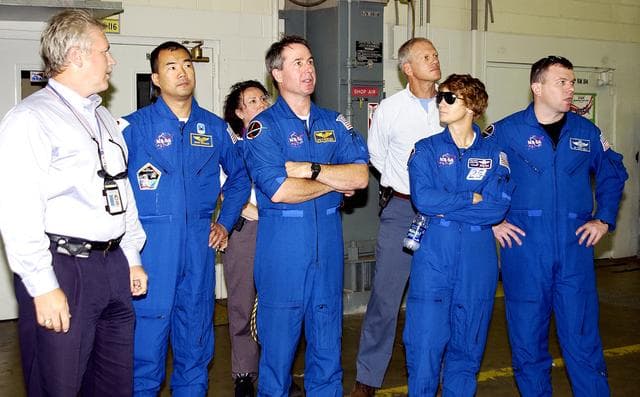 NASA image: KENNEDY SPACE CENTER, FLA. -  In Hangar AF, Cape Canaveral Air Force Station, the STS-114 crew look at equipment used to disassemble and refurbish solid rocket boosters retrieved after a Shuttle launch.  Starting second from left are Mission Specialist Soichi Noguchi, Mission Specialist Stephen Robinson, Commander Eileen Collins, and Pilot James Kelly. Noguchi is with the Japanese space agency NASDA.  At far left is Joseph Chaput, with United Space Alliance. On their mission, the crew will carry the MultiPurpose Logistics Module (MPLM) Raffaello and External Stowage Platform 2 to the International Space Station.  The MPLM will contain supplies and equipment.  Another goal of the mission is to remove and replace a Control Moment Gyro.  Launch date for mission STS-114 is under review.