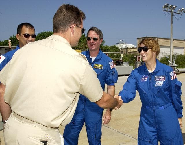 NASA image: KENNEDY SPACE CENTER, FLA. -  Members of the STS-114 crew are welcomed to the Liberty Star, one of two SRB Retrieval Ships, by Captain Bren Wade (back to camera).  Crew members, from left, are Mission Specialist Soichi Noguchi, Mission Specialist Stephen Robinson and Commander Eileen Collins. Noguchi is with the Japanese space agency NASDA. Not pictured is Pilot James Kelly.  On their mission, the crew will carry the MultiPurpose Logistics Module (MPLM) Raffaello and External Stowage Platform 2 to the International Space Station.  The MPLM will contain supplies and equipment.  Another goal of the mission is to remove and replace a Control Moment Gyro.  Launch date for mission STS-114 is under review.