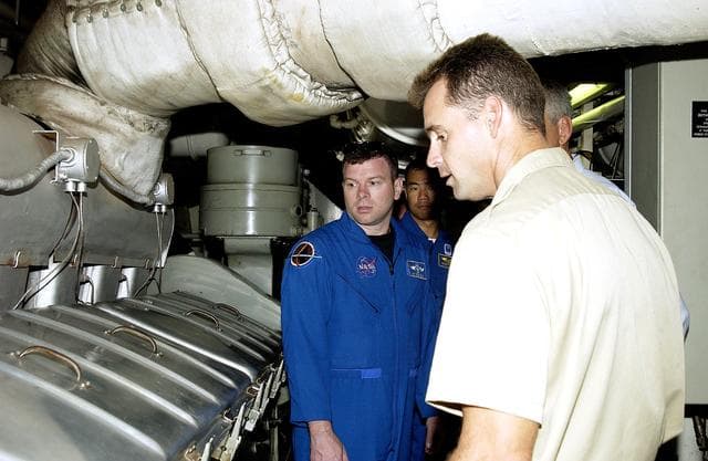 NASA image: KENNEDY SPACE CENTER, FLA. -   Captain Bren Wade of the Liberty Star, one of two SRB Retrieval Ships, talks to STS-114 crew members about the engines.  Seen at left are Pilot James Kelly and Mission Specialist Soichi Noguchi, who is with the Japanese space agency NASDA..   On their mission, the crew  - which includes Commander Eileen Collins and Mission Specialist Stephen Robinson - will carry the MultiPurpose Logistics Module (MPLM) Raffaello and External Stowage Platform 2 to the International Space Station.  The MPLM will contain supplies and equipment.  Another goal of the mission is to remove and replace a Control Moment Gyro.  Launch date for mission STS-114 is under review.