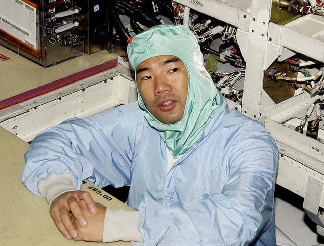 NASA image: KENNEDY SPACE CENTER, FLA. -   STS-114 Mission Specialist Soichi Noguchi checks the midbody of orbiter Atlantis.  He and other crew members -  Commander Eileen Collins, Pilot James Kelly and Mission Specialist Stephen Robinson - are at KSC for equipment familiarization.  Noguchi is with the Japanese space agency NASDA.  Mission STS-114 will carry the MultiPurpose Logistics Module (MPLM) Raffaello and External Stowage Platform 2 to the International Space Station.  The MPLM will contain supplies and equipment.  Another goal of the mission is to remove and replace a Control Moment Gyro.  Launch date for mission STS-114 is under review.