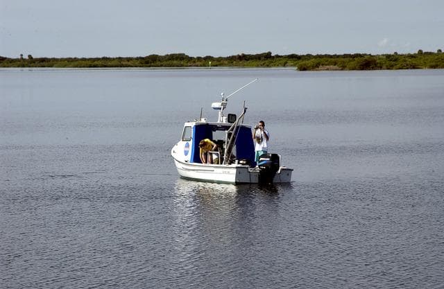 NASA image: KENNEDY SPACE CENTER, FLA.  -  Researchers are positioned on one of the watercraft being utilized to conduct underwater acoustic research in the Launch Complex 39 turn basin.  Several government agencies, including NASA, NOAA, the Navy, the Coast Guard, and the Florida Fish and Wildlife Commission are involved in the testing. The research involves demonstrations of passive and active sensor technologies, with applications in fields ranging from marine biological research to homeland security. The work is also serving as a pilot project to assess the cooperation between the agencies involved. Equipment under development includes a passive acoustic monitor developed by NASA’s Jet Propulsion Laboratory, and mobile robotic sensors from the Navy’s Mobile Diving and Salvage Unit.