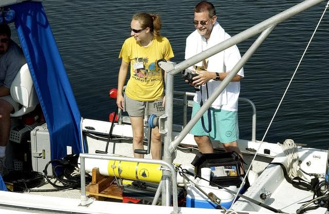 NASA image: KENNEDY SPACE CENTER, FLA.  -  Research team members take their places on one of the watercraft being utilized to conduct underwater acoustic research in the Launch Complex 39 turn basin.  Several government agencies, including NASA, NOAA, the Navy, the Coast Guard, and the Florida Fish and Wildlife Commission are involved in the testing. The research involves demonstrations of passive and active sensor technologies, with applications in fields ranging from marine biological research to homeland security. The work is also serving as a pilot project to assess the cooperation between the agencies involved. Equipment under development includes a passive acoustic monitor developed by NASA’s Jet Propulsion Laboratory, and mobile robotic sensors from the Navy’s Mobile Diving and Salvage Unit.