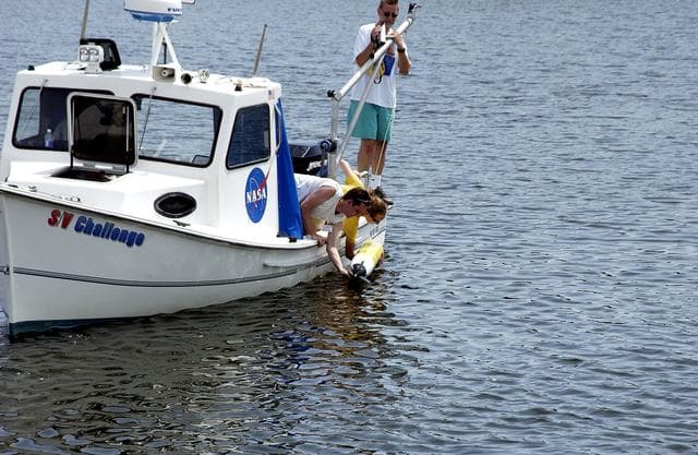 NASA image: KENNEDY SPACE CENTER, FLA.  -  Research team members aboard one of the watercraft being utilized to conduct underwater acoustic research in the Launch Complex 39 turn basin release some of the project's equipment into the water.  Several government agencies, including NASA, NOAA, the Navy, the Coast Guard, and the Florida Fish and Wildlife Commission are involved in the testing. The research involves demonstrations of passive and active sensor technologies, with applications in fields ranging from marine biological research to homeland security. The work is also serving as a pilot project to assess the cooperation between the agencies involved. Equipment under development includes a passive acoustic monitor developed by NASA’s Jet Propulsion Laboratory, and mobile robotic sensors from the Navy’s Mobile Diving and Salvage Unit.