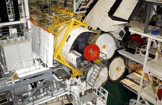 NASA image: KENNEDY SPACE CENTER, FLA. -  In the Orbiter Processing Facility, technicians prepare to remove an Orbital Maneuvering System (OMS) pod from the orbiter Atlantis during routine maintenance.
