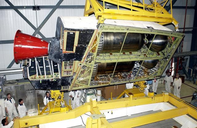 NASA image: KENNEDY SPACE CENTER, FLA. - In the Orbiter Processing Facility, an Orbital Maneuvering System (OMS) pod is removed from  the orbiter Atlantis during routine maintenance.