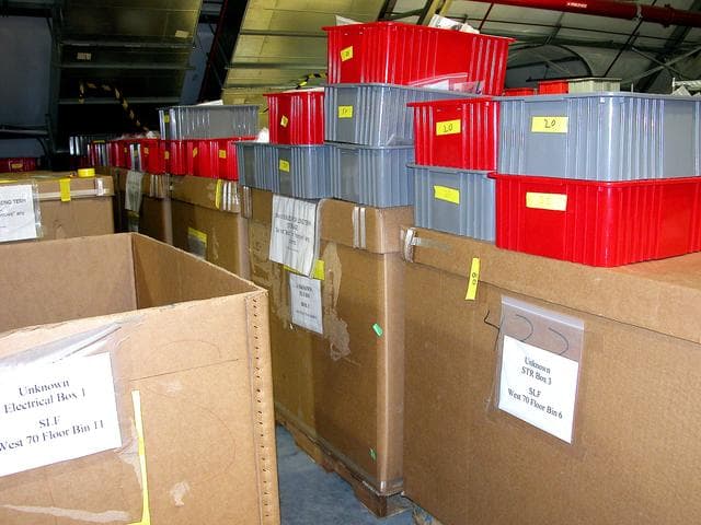 KENNEDY SPACE CENTER, FLA.  -  Storage boxes and other containers of Columbia debris wait in the Columbia Debris Hangar for transfer to storage in the Vehicle Assembly Building.  About 83,000 pieces were shipped to KSC during search and recovery efforts in East Texas.