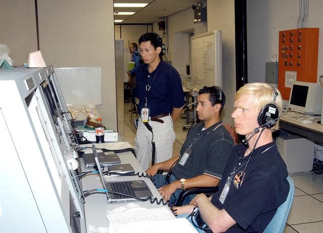 NASA image: KENNEDY SPACE CENTER, FLA. -   Workers in the Space Station Processing Facility observe consoles during a Multi-Element Integrated Test (MEIT) of the U.S. Node 2 and the Japanese Experiment Module (JEM).   Node 2 attaches to the end of the U.S. Lab on the ISS and provides attach locations for the Japanese laboratory, European laboratory, the Centrifuge Accommodation Module and, eventually, Multipurpose Logistics Modules. It will provide the primary docking location for the Shuttle when a pressurized mating adapter is attached to Node 2.  Installation of the module will complete the U.S. Core of the ISS.   The JEM, developed by the National Space Development Agency of Japan (NASDA), is Japan's primary contribution to the Station. It will enhance the unique research capabilities of the orbiting complex by providing an additional environment for astronauts to conduct science experiments.