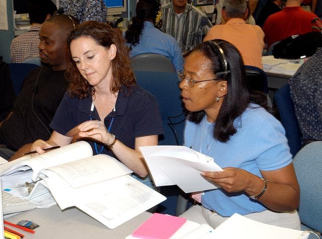 NASA image: KENNEDY SPACE CENTER, FLA. -   Workers in the Space Station Processing Facility look over paperwork during a Multi-Element Integrated Test (MEIT) of the U.S. Node 2 and the Japanese Experiment Module (JEM).   Node 2 attaches to the end of the U.S. Lab on the ISS and provides attach locations for the Japanese laboratory, European laboratory, the Centrifuge Accommodation Module and, eventually, Multipurpose Logistics Modules. It will provide the primary docking location for the Shuttle when a pressurized mating adapter is attached to Node 2.  Installation of the module will complete the U.S. Core of the ISS.   The JEM, developed by the National Space Development Agency of Japan (NASDA), is Japan's primary contribution to the Station. It will enhance the unique research capabilities of the orbiting complex by providing an additional environment for astronauts to conduct science experiments.