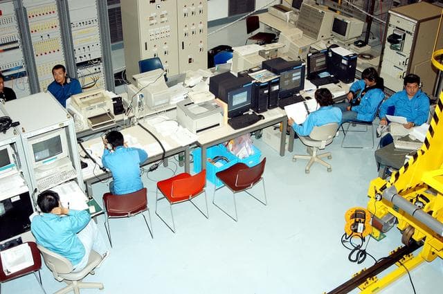NASA image: KENNEDY SPACE CENTER, FLA. -  Workers in the Space Station Processing Facility are lined up at consoles during  a Multi-Element Integrated Test (MEIT ) of the Japanese Experiment Module (JEM) and U.S. Node 2.  Node 2 attaches to the end of the U.S. Lab on the ISS and provides attach locations for the Japanese laboratory, European laboratory, the Centrifuge Accommodation Module and, eventually, Multipurpose Logistics Modules. It will provide the primary docking location for the Shuttle when a pressurized mating adapter is attached to Node 2.  Installation of the module will complete the U.S. Core of the ISS.   The JEM, developed by NASDA,  is Japan's primary contribution to the Station. It will enhance the unique research capabilities of the orbiting complex by providing an additional environment for astronauts to conduct science experiments.