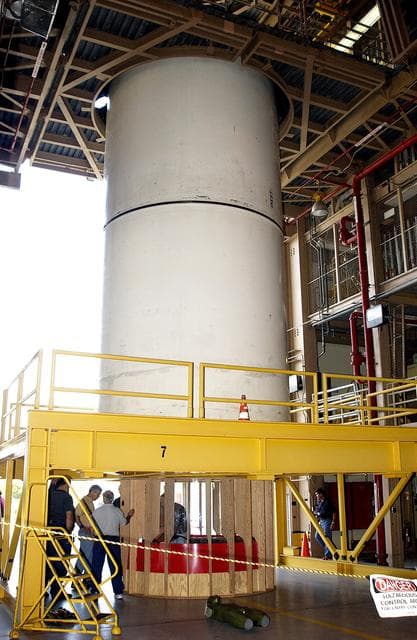 NASA image: KENNEDY SPACE CENTER, FLA. -  At the Rotation, Processing and Surge Facility stand a mockup of two segments of a solid rocket booster (SRB) being used to test the feasibility of a vertical SRB propellant grain inspection, required as part of safety analysis.