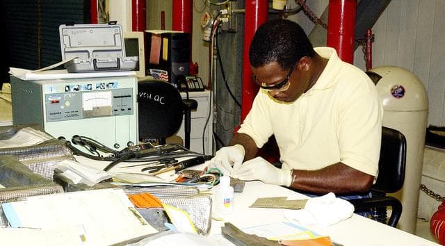 NASA image: KENNEDY SPACE CENTER, FLA. -   United Space Alliance employee Anthony Simmons prepares to electroweld a crack found on an insulator inside a Reinforced Carbon Carbon panel.   The gray carbon composite RCC panels are attached to the leading edge of the wing of the orbiters to withstand the aerodynamic forces experienced during launch and reentry, which can reach as high as 800 pounds per square foot.  The operating range of RCC is from minus 250º F to about 3,000º F, the temperature produced by friction with the atmosphere during reentry.