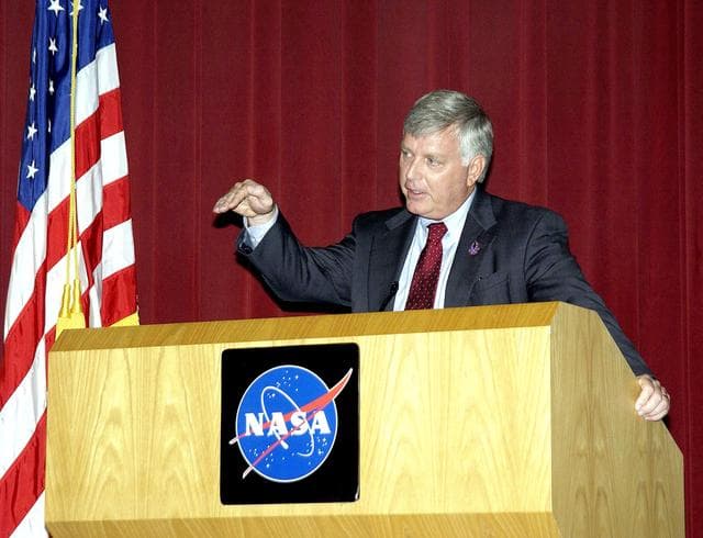 NASA image: KENNEDY SPACE CENTER, FLA. -  Center Director Jim Kennedy talks to employees during his first all-hands meeting. Making presentations were Dr. Woodrow Whitlow Jr., KSC deputy director;Tim Wilson, assistant chief engineer for Shuttle; and Bill Pickavance, vice president and deputy program manager, Florida operations, United Space Alliance..  Representatives from the Shuttle program and contractor team were on hand to discuss the Columbia Accident Investigation Board report and where KSC stands in its progress toward return to flight.