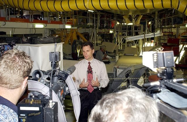 NASA image: KENNEDY SPACE CENTER, FLA. -   NASA Vehicle Manager Scott Thurston talks to the media in the Orbiter Processing Facility.  The media was invited to see the orbiter Atlantis as it is being prepared for Return to Flight.  Both local and national reporters representing print and TV networks were able to see work in progress on Atlantis, including the reinstallation of the Reinforced Carbon-Carbon panels on the orbiter’s wing leading edge; wiring inspections; and checks of the engines in the Orbital Maneuvering System.