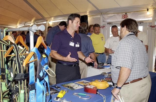 NASA image: KENNEDY SPACE CENTER, FLA. - Employees file around table displays under a tent near the Vehicle Assembly Building.  Many vendors displayed their products during the Spaceport Super Safety and Health Day at KSC, an annual event dedicated to reinforcing safe and healthful behaviors in the workforce.