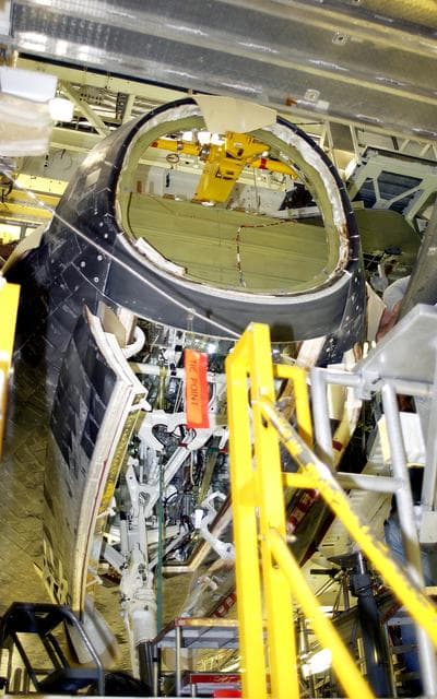 NASA image: KENNEDY SPACE CENTER, FLA. - In the Orbiter Processing Facility, Atlantis is seen after its nose cap was removed for routine inspection. The nose cap is made of reinforced carbon-carbon (RCC), which has an operating range of minus 250° F to about 3,000° F.
