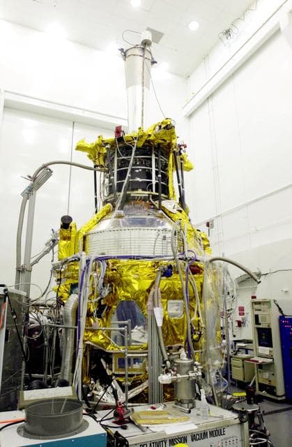 NASA image: VANDENBERG AFB, CALIF. -   In the spacecraft processing facility on North Vandenberg Air Force Base, the Gravity Probe B experiment sits on an assembly and test stand where it has been subject to various prelaunch testing.  The Gravity Probe B will launch a payload of four gyroscopes into low-Earth polar orbit to test two extraordinary predictions of Albert Einstein’s general theory of relativity: the geodetic effect (how space and time are warped by the presence of the Earth) and frame dragging (how Earth’s rotation drags space and time around with it). Once in orbit, for 18 months each gyroscope’s spin axis will be monitored as it travels through local spacetime, observing and measuring these effects.  The experiment was developed by Stanford University, Lockheed Martin and NASA’s Marshall Space Flight Center.   The targeted launch date is Dec. 6, 2003.