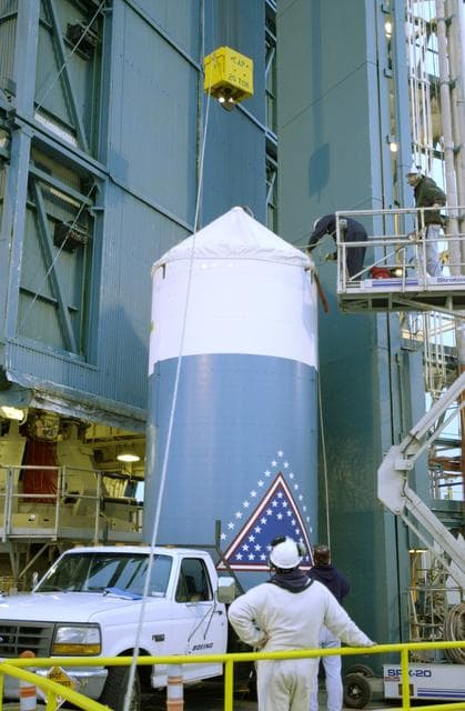 NASA image: VANDENBERG AFB, CALIF. -  The interstage of the Delta II launch vehicle for the Gravity Probe B experiment is  prepared for lifting up the mobile service tower on Space Launch Complex 2, Vandenberg Air Force Base, Calif.  It will enclose the second stage.  The Gravity Probe B will launch a payload of four gyroscopes into low-Earth polar orbit to test two extraordinary predictions of Albert Einstein’s general theory of relativity: the geodetic effect (how space and time are warped by the presence of the Earth) and frame dragging (how Earth’s rotation drags space and time around with it). Once in orbit, for 18 months each gyroscope’s spin axis will be monitored as it travels through local spacetime, observing and measuring these effects.  The experiment was developed by Stanford University, Lockheed Martin and NASA’s Marshall Space Flight Center.  The targeted launch date is Dec. 6, 2003.