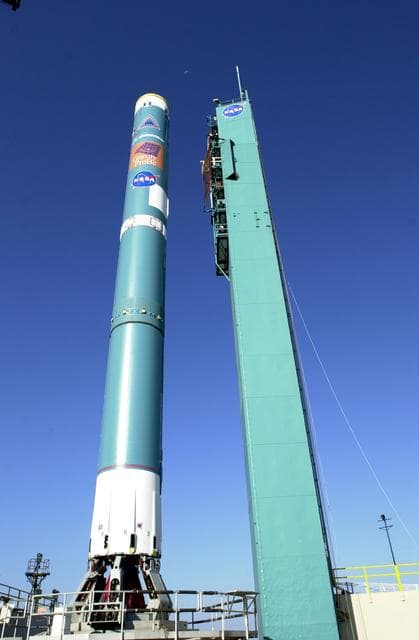 NASA image: VANDENBERG AFB, CALIF. -  The mobile service tower on Space Launch Complex 2, Vandenberg Air Force Base, Calif., rolls back from the Delta II rocket that will launch the Gravity Probe B experiment.  The Gravity Probe B will launch a payload of four gyroscopes into low-Earth polar orbit to test two extraordinary predictions of Albert Einstein’s general theory of relativity: the geodetic effect (how space and time are warped by the presence of the Earth) and frame dragging (how Earth’s rotation drags space and time around with it). Once in orbit, for 18 months each gyroscope’s spin axis will be monitored as it travels through local spacetime, observing and measuring these effects.  The experiment was developed by Stanford University, Lockheed Martin and NASA’s Marshall Space Flight Center.  The targeted launch date is Dec. 6, 2003.