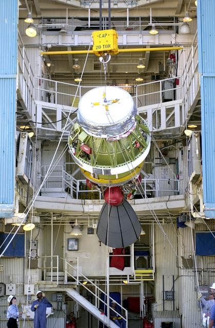 NASA image: VANDENBERG AFB, CALIF. -  The second stage of the Delta II launch vehicle for the Gravity Probe B experiment is lifted up the mobile service tower on Space Launch Complex 2, Vandenberg Air Force Base, Calif.  The Gravity Probe B will launch a payload of four gyroscopes into low-Earth polar orbit to test two extraordinary predictions of Albert Einstein’s general theory of relativity: the geodetic effect (how space and time are warped by the presence of the Earth) and frame dragging (how Earth’s rotation drags space and time around with it). Once in orbit, for 18 months each gyroscope’s spin axis will be monitored as it travels through local spacetime, observing and measuring these effects.  The experiment was developed by Stanford University, Lockheed Martin and NASA’s Marshall Space Flight Center.  The targeted launch date is Dec. 6, 2003.