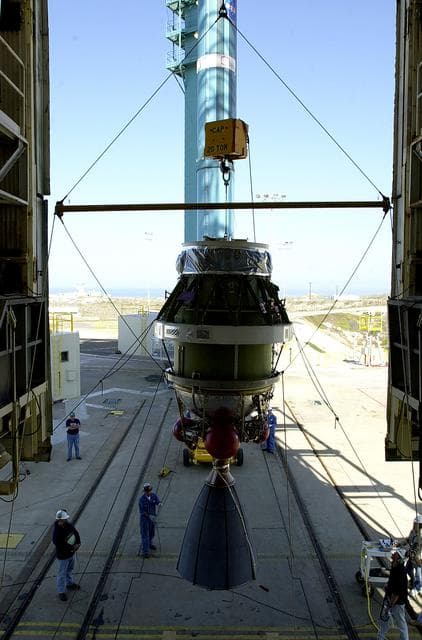 NASA image: VANDENBERG AFB, CALIF. -  Viewed from inside, the second stage of the Delta II launch vehicle for the Gravity Probe B experiment is lifted up the mobile service tower on Space Launch Complex 2, Vandenberg Air Force Base, Calif.   The Gravity Probe B will launch a payload of four gyroscopes into low-Earth polar orbit to test two extraordinary predictions of Albert Einstein’s general theory of relativity: the geodetic effect (how space and time are warped by the presence of the Earth) and frame dragging (how Earth’s rotation drags space and time around with it). Once in orbit, for 18 months each gyroscope’s spin axis will be monitored as it travels through local spacetime, observing and measuring these effects.  The experiment was developed by Stanford University, Lockheed Martin and NASA’s Marshall Space Flight Center.  The targeted launch date is Dec. 6, 2003.