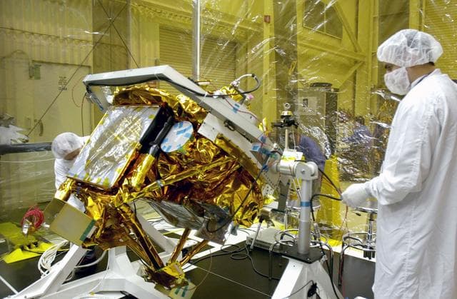 NASA image: VANDENBERG AIR FORCE BASE, CALIF.- At Vandenberg Air Force Base, Calif., spacecraft functional testing is underway on the SciSat-1. The solar arrays are being attached and the communications systems are also being checked out.   The SciSat-1 weighs approximately 330 pounds and after launch will be placed in a 400-mile-high polar orbit to investigate processes that control the distribution of ozone in the upper atmosphere. The data from the satellite will provide Canadian and international scientists with improved measurements relating to global ozone processes and help policymakers assess existing environmental policy and develop protective measures for improving the health of our atmosphere, preventing further ozone depletion. The mission is designed to last two years.