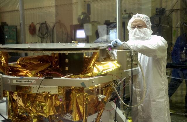 NASA image: VANDENBERG AIR FORCE BASE, CALIF.- At Vandenberg Air Force Base, Calif., spacecraft functional testing is underway on the SciSat-1. The solar arrays are being attached and the communications systems are also being checked out.   The SciSat-1 weighs approximately 330 pounds and after launch will be placed in a 400-mile-high polar orbit to investigate processes that control the distribution of ozone in the upper atmosphere. The data from the satellite will provide Canadian and international scientists with improved measurements relating to global ozone processes and help policymakers assess existing environmental policy and develop protective measures for improving the health of our atmosphere, preventing further ozone depletion. The mission is designed to last two years.