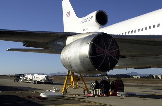 NASA image: VANDENBERG AIR FORCE BASE, CALIF. - The SciSat-1 payload, with fairing installed and attached to its Pegasus launch vehicle, arrives at the pad for mating to the L-1011 carrier aircraft.  The SciSat-1 weighs approximately 330 pounds and after launch will be placed in a 400-mile-high polar orbit to investigate processes that control the distribution of ozone in the upper atmosphere. The data from the satellite will provide Canadian and international scientists with improved measurements relating to global ozone processes and help policymakers assess existing environmental policy and develop protective measures for improving the health of our atmosphere, preventing further ozone depletion. The mission is designed to last two years.