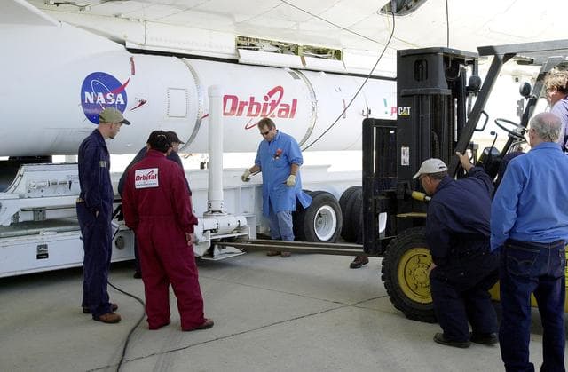 NASA image: VANDENBERG AIR FORCE BASE, CALIF. -  The SciSat-1 payload and Pegasus launch vehicle are lifted and mated to the L-1011 carrier aircraft.  The SciSat-1 weighs approximately 330 pounds and after launch will be placed in a 400-mile-high polar orbit to investigate processes that control the distribution of ozone in the upper atmosphere. The data from the satellite will provide Canadian and international scientists with improved measurements relating to global ozone processes and help policymakers assess existing environmental policy and develop protective measures for improving the health of our atmosphere, preventing further ozone depletion. The mission is designed to last two years.