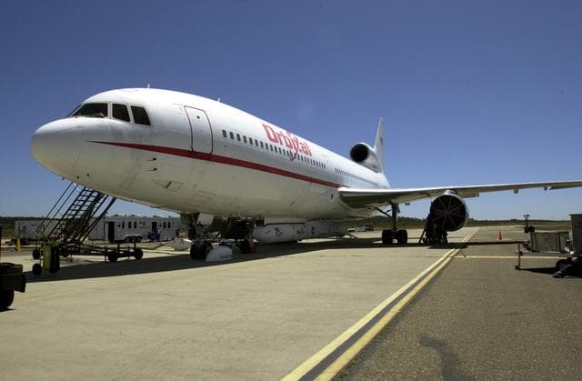 NASA image: VANDENBERG AIR FORCE BASE, CALIF. -  The L-1011 carrier aircraft is ready for flight after undergoing a Combined Systems Test, an integrated test involving the Pegasus launch vehicle, SciSat-1 spacecraft and L-1011 aircraft.  The SciSat-1 weighs approximately 330 pounds and after launch will be placed in a 400-mile-high polar orbit to investigate processes that control the distribution of ozone in the upper atmosphere. The data from the satellite will provide Canadian and international scientists with improved measurements relating to global ozone processes and help policymakers assess existing environmental policy and develop protective measures for improving the health of our atmosphere, preventing further ozone depletion. The mission is designed to last two years.