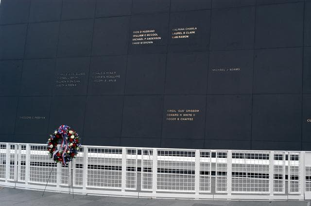 NASA image: KENNEDY SPACE CENTER, FLA. -  A ceremonial wreath is placed at the Space Mirror Memorial at the Kennedy Space Center Visitor Complex.  During this dedication ceremony, the names of the STS-107 astronauts who lost their lives during the Columbia accident -- Rick Husband, Willie McCool, Laurel Clark, Michael Anderson, David Brown, Kalpana Chawla, and Ilan Ramon -- join the names of 17 other space heroes who gave their lives for the U.S. space program. The "Space Mirror," 42 1/2 feet high by 50 feet wide, illuminates the names of the fallen astronauts cut through the monument's black granite surface.