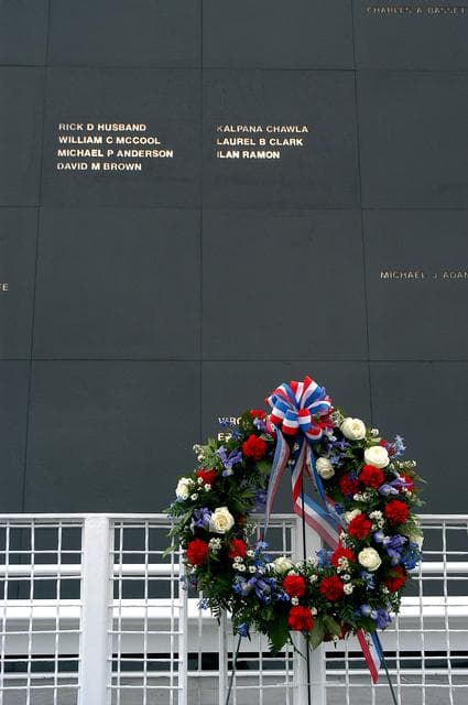 NASA image: KENNEDY SPACE CENTER, FLA. -  A ceremonial wreath is placed at the Space Mirror Memorial at the Kennedy Space Center Visitor Complex.  During this dedication ceremony, the names of the STS-107 astronauts who lost their lives during the Columbia accident -- Rick Husband, Willie McCool, Laurel Clark, Michael Anderson, David Brown, Kalpana Chawla, and Ilan Ramon -- join the names of 17 other space heroes who gave their lives for the U.S. space program. The "Space Mirror," 42 1/2 feet high by 50 feet wide, illuminates the names of the fallen astronauts cut through the monument's black granite surface.