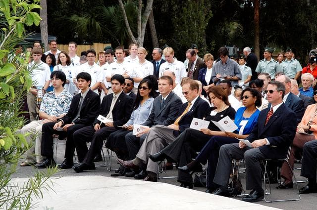 NASA image: KENNEDY SPACE CENTER, FLA. -- Family members of the STS-107 astronauts and other dignitaries gather for the dedication ceremony of the Columbia Village at the Florida Institute of Technology in Melbourne, Fla.  Each of the seven new residence halls in the complex is named for one of the STS-107 astronauts who perished during the Columbia accident -- Rick Husband, Willie McCool, Laurel Clark, Michael Anderson, David Brown, Kalpana Chawla, and Ilan Ramon.