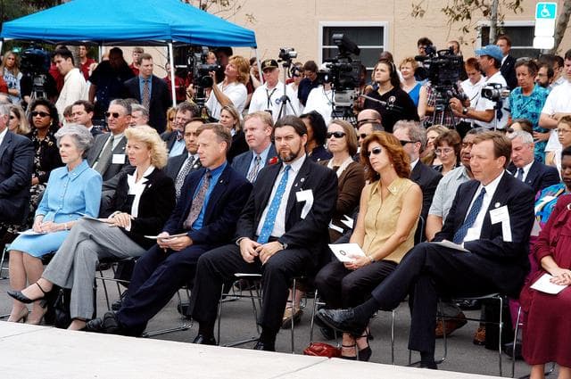 NASA image: KENNEDY SPACE CENTER, FLA. -- Family members of the STS-107 astronauts and other dignitaries gather for the dedication ceremony of the Columbia Village at the Florida Institute of Technology in Melbourne, Fla.  Each of the seven new residence halls in the complex is named for one of the STS-107 astronauts who perished during the Columbia accident -- Rick Husband, Willie McCool, Laurel Clark, Michael Anderson, David Brown, Kalpana Chawla, and Ilan Ramon.