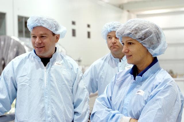 NASA image: KENNEDY SPACE CENTER, FLA. - In the Space Station Processing Facility, STS-114 Pilot James Kelly (left) and Commander Eileen Collins look at various equipment housed there.  The STS-114 crew is at KSC to take part in crew equipment and orbiter familiarization.