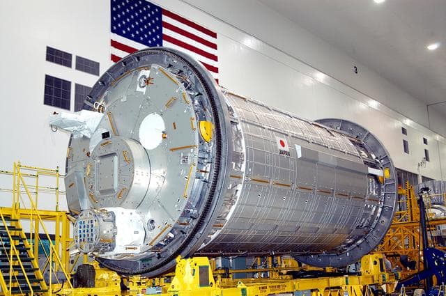 NASA image: KENNEDY SPACE CENTER, FLA. - In the Space Station Processing Facility, the Japanese Experiment Module (JEM) rests on a workstand during pre-assembly measurement activities. Developed by the Japan Aerospace Exploration Agency (JAXA), the JEM will enhance the unique research capabilities of the orbiting complex by providing an additional environment for astronauts to conduct science experiments.