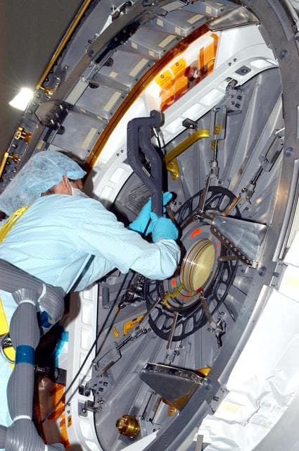 NASA image: KENNEDY SPACE CENTER, FLA. - In the Space Station Processing Facility, a technician takes readings for pre-assembly measurements on the Japanese Experiment Module (JEM).  Developed by the Japan Aerospace Exploration Agency (JAXA), the JEM will enhance the unique research capabilities of the orbiting complex by providing an additional environment for astronauts to conduct science experiments.