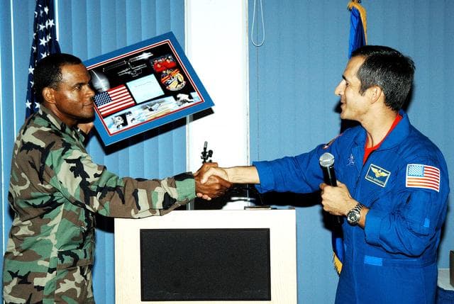NASA image: KENNEDY SPACE CENTER, FLA. -  Col. Everett Thomas (left), 45th Space Wing, presents a framed memento to astronaut John Herrington during a luncheon celebrating Native American Heritage Month held at the Patrick Air Force Base NCO Club.  Herrington is a tribally enrolled Chickasaw and the world’s first Native American astronaut, who last flew on mission STS-113 in 2002.