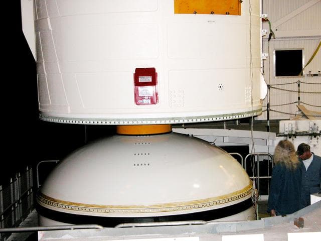 NASA image: KENNEDY SPACE CENTER, FLA. -  In the Vehicle Assembly Building, the forward assembly (nose cap and frustum) is moved away from the solid rocket booster (SRB).  The destacking is part of time and cycle activities.  The SRB was part of the stack on Atlantis originally scheduled for a March 1, 2003, launch on mission STS-114.  The SRBs and external tank were demated in February 2003.   The mission is now scheduled to occur no earlier than Sept. 12, 2004, on Atlantis.