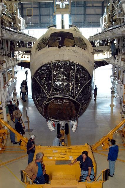NASA image: KENNEDY SPACE CENTER, FLA. -  The orbiter Atlantis is back inside the Orbiter Processing Facility after spending 10 days in the Vehicle Assembly Building.  The hiatus in the VAB allowed work to be performed in the OPF that can only be accomplished while the bay is empty. Work included annual validation of the bay's cranes, work platforms, lifting mechanisms and jack stands.  Work resumes to prepare Atlantis for launch in September 2004 on the first return-to-flight mission, STS-114.