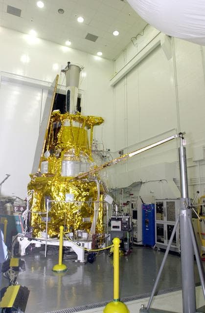 NASA image: VANDENBERG AFB, CALIF. -  In the NASA spacecraft processing facility on North Vandenberg Air Force Base, the Gravity Probe B spacecraft is seen with two solar array panels installed.  Installing each array is a 3-day process and includes a functional deployment test.  The Gravity Probe B mission is a relativity experiment developed by NASA’s Marshall Space Flight Center, Stanford University and Lockheed Martin.  The spacecraft will test two extraordinary predictions of Albert Einstein’s general theory of relativity that he advanced in 1916: the geodetic effect (how space and time are warped by the presence of the Earth) and frame dragging (how Earth’s rotation drags space and time around with it).  Gravity Probe B consists of four sophisticated gyroscopes that will provide an almost perfect space-time reference system.  The mission will look in a precision manner for tiny changes in the direction of spin.