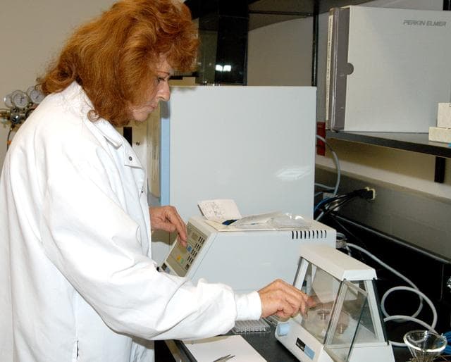 NASA image: KENNEDY SPACE CENTER, FLA. -- In the Space Life Sciences (SLS) Lab, Jan Bauer, with Dynamac Corp., places samples of onion tissue in the elemental analyzer, which analyzes for carbon, hydrogen, nitrogen and sulfur. The 100,000 square-foot SLS houses labs for NASA’s ongoing research efforts, microbiology/microbial ecology studies and analytical chemistry labs. Also calling the new lab home are facilities for space flight-experiment and flight-hardware development, new plant growth chambers, and an Orbiter Environment Simulator that will be used to conduct ground control experiments in simulated flight conditions for space flight experiments.  The SLS Lab, formerly known as the Space Experiment Research and Processing Laboratory or SERPL, provides space for NASA’s Life Sciences Services contractor Dynamac Corporation, Bionetics Corporation, and researchers from the University of Florida. NASA’s Office of Biological and Physical Research will use the facility for processing life sciences experiments that will be conducted on the International Space Station. The SLS Lab is the magnet facility for the International Space Research Park at KSC being developed in partnership with Florida Space Authority.