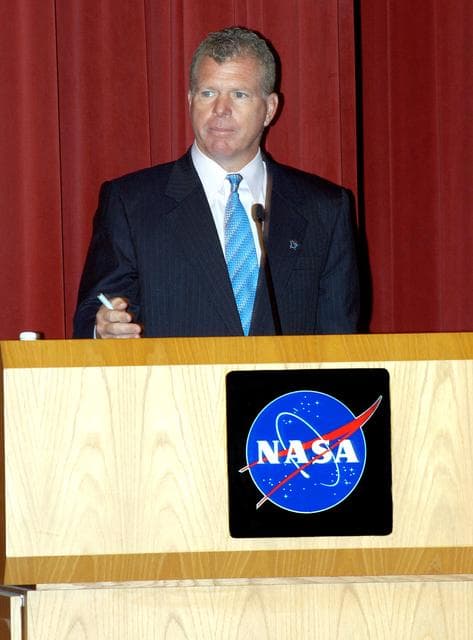 NASA image: KENNEDY SPACE CENTER, FLA. -- U.S. Rep. Tom Feeney addresses employees in a Town Hall meeting at KSC with comments on the new mission for NASA outlined by President George W. Bush Jan. 14.  He shared the stage with U.S. Rep. Dave Weldon and Center Director Jim Kennedy. All three later answered questions from employees in the audience.