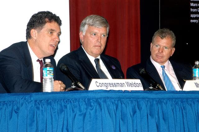 NASA image: KENNEDY SPACE CENTER, FLA. -- In a Town Hall meeting at KSC, Center Director Jim Kennedy (center) joined U.S. Reps. Dave Weldon (left) and Tom Feeney (right) to discuss the new mission for NASA outlined by President George W. Bush Jan. 14.  The congressmen and Kennedy also answered questions from employees in the audience.