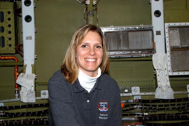 NASA image: KENNEDY SPACE CENTER, FLA. -  NASA Vehicle Manager for Discovery, Stephanie Stilson poses for a photo after working with a KSC Web team who were filming a special feature for the KSC Web.  Stilson explained her role in the recent Orbiter Major Modification period, which included inspection, modifications and reservicing of most systems onboard. The work on Discovery also included the installation of a Multifunction Electronic Display Subsystem (MEDS) - a state-of-the-art “glass cockpit.”  The orbiter is now being prepared for eventual launch on a future mission.
